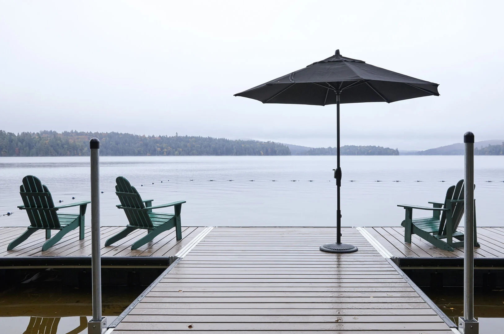 Daytime view of Saranac Lake lake from the porch of a vacation rental