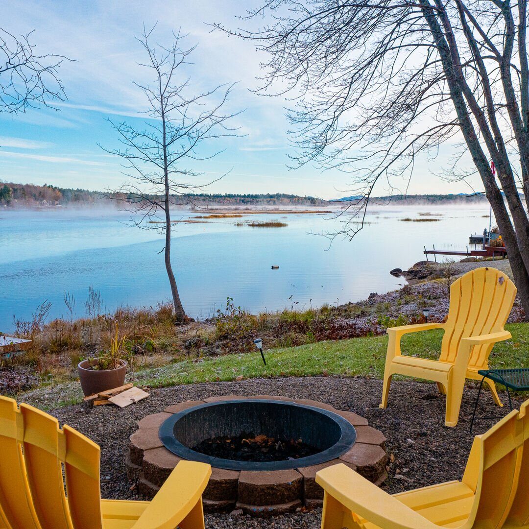 Daytime view of Tupper Lake lake from the porch of a vacation rental